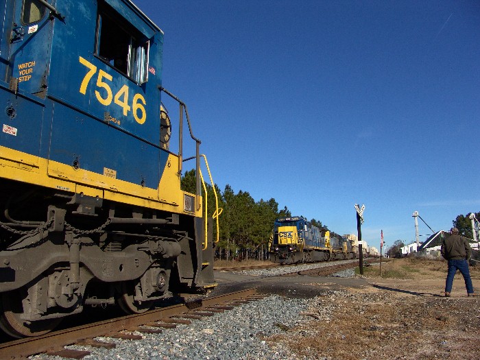 Engineer standing guard for CSX 7546 during run-by